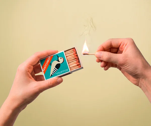 Hand Holding Matchbox Ignition Scene PSD Mockup