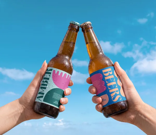 Refreshing Summer Amber Beer Bottles PSD Mockup - Cheers Pose