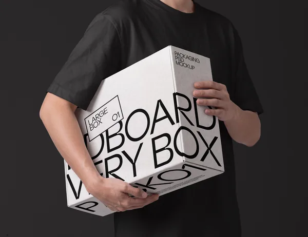 Holding Large Cardboard Delivery Box Packaging PSD Mockup